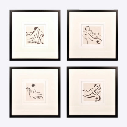 four framed prints of black and white nudes