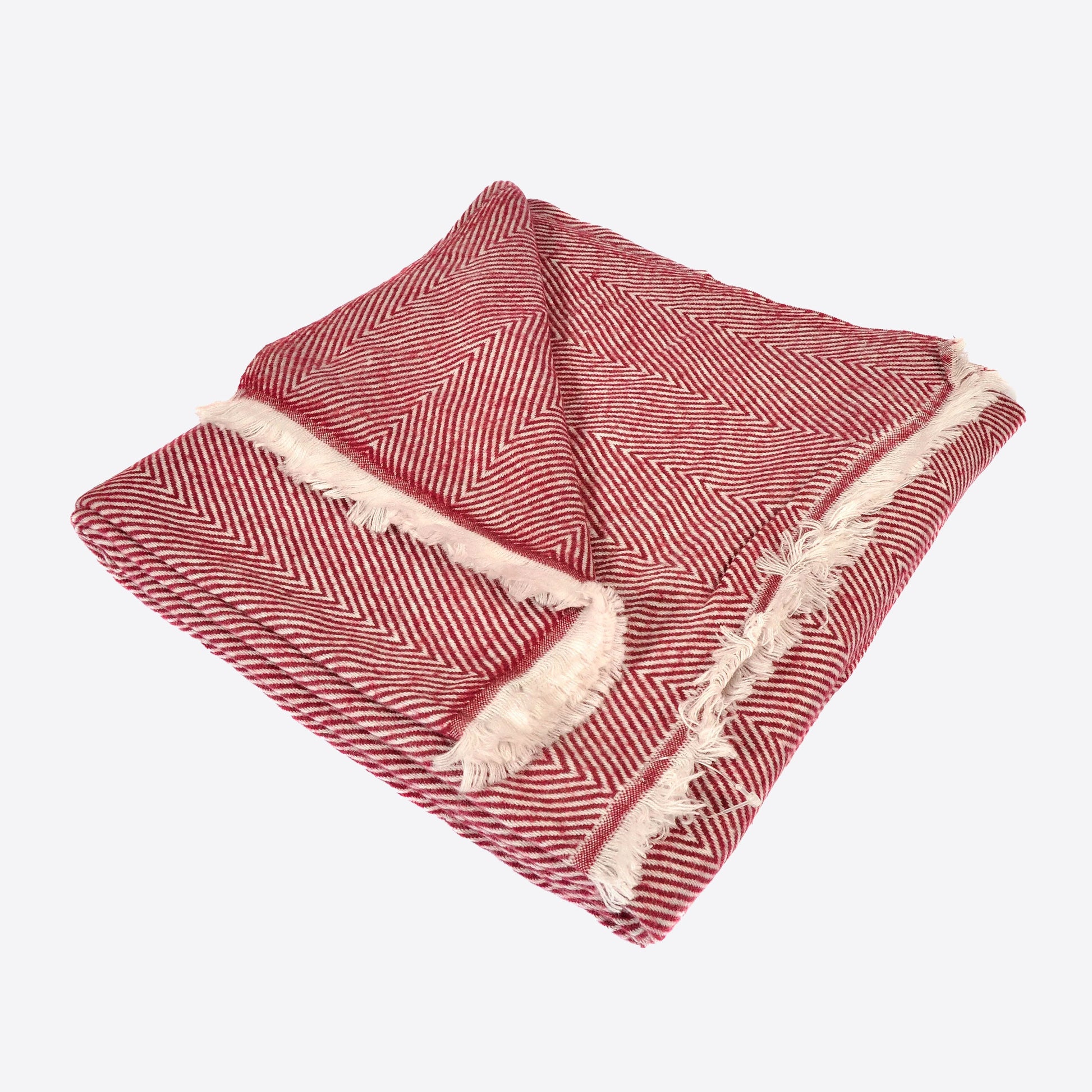 Dark red herringbone pattern throw with white tasseled edge