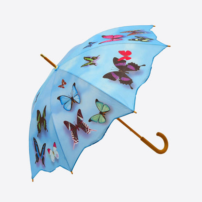Blue umbrella with colourful butterflies and and wooden handle